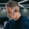 Sluchátka AfterShokz OpenComm před uši s mikrofonem, Bluetooth, šedá