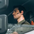 Sluchátka AfterShokz OpenComm před uši s mikrofonem, Bluetooth, šedá